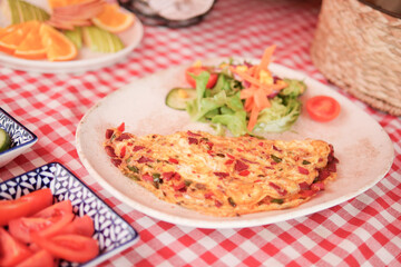 Delicious vegetable omelette served with fresh salad