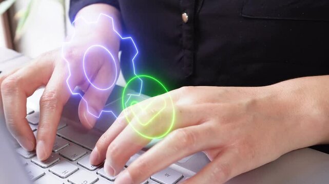 Woman working on laptop with a virtual icon of a gear and a check mark