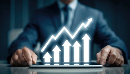 Businessman with growing graph on tablet
