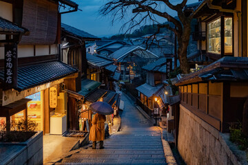 Traditional building filled street in Gion Kyoto Japan. Photo taken during the evening at blue hour