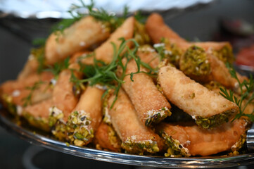 pistachio straws, pastry dough filled with pistachio cream, puff pastry	
