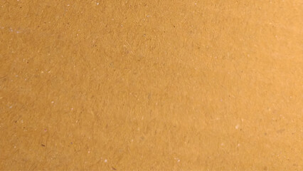 Background of brown kraft paper or cardboard texture. Abstract pattern of beige rough carton, old paper sheet, parchment or papyrus surface.