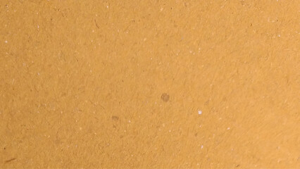 Background of brown kraft paper or cardboard texture. Abstract pattern of beige rough carton, old paper sheet, parchment or papyrus surface.