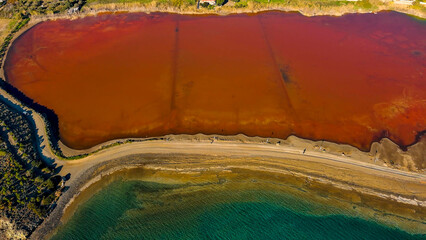 Red salt sea lake, at winter, village Alyki, Boeotia, Greece.