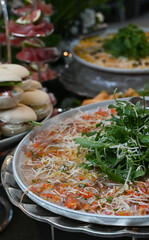 carpaccio , thin beef carpaccio with arugula and parmesan, gourmet meat appetizer with vinaigrette...