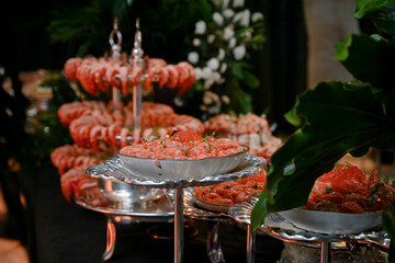 salmon tartare, salmon tartare with guacamole, fresh salmon, Japanese food, Japanese cuisine, haute cuisine, salmon ceviche in an ice bowl for an elegant buffet, gourmet salmon tartare served cold on 