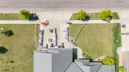 Aerial view above a garage yard sale in a residential area 