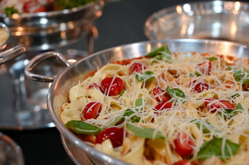 spaghetti, spaghetti with cheese and cherry tomatoes, tagliatelle, delicious pasta dishes, buffet display, gourmet buffet, pasta, hot dishes, elegant buffet trays, haute cuisine, buffet for events


