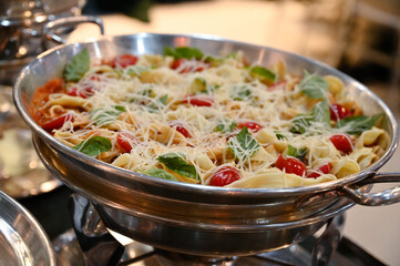 spaghetti, spaghetti with cheese and cherry tomatoes, tagliatelle, delicious pasta dishes, buffet...
