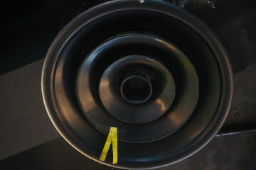 Supply and exhaust ventilation pipe on ceiling of retail space or warehouse or other commercial...