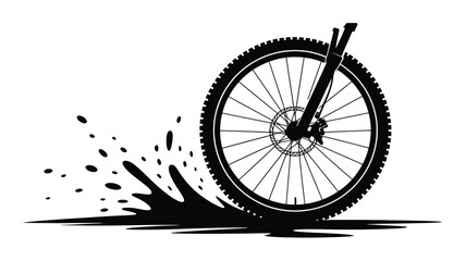 Black silhouette of a mountain bike wheel kicking up dirt and water splash