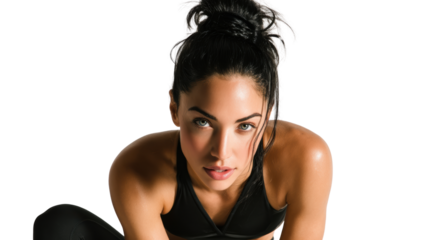 Athletic woman in workout attire, focused expression, isolated on a white background.