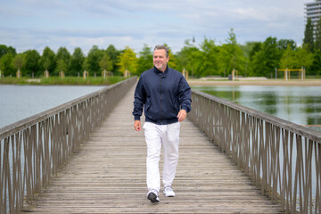 Happy Senior Man Walking Outdoors