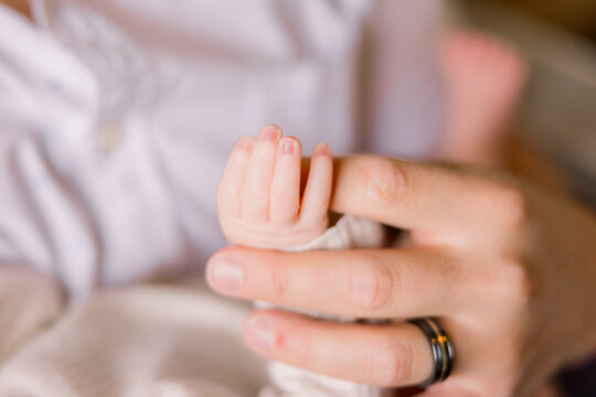 hand of a newborn baby - Powered by Adobe