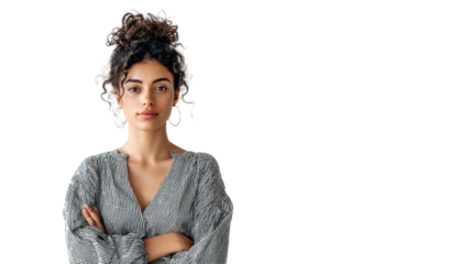 Confident young woman with curly hair, arms crossed, isolated on white background.