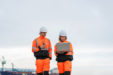 Maritime Safety Engineers Working at Harbor Site, Industrial Engineers Collaborating at Port...