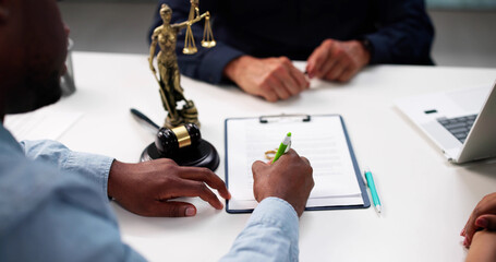 African-American Man And Hispanic Woman Consult Divorce Lawyer