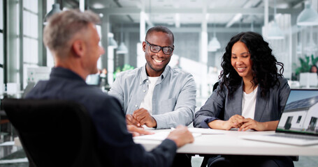 Professional Realtor Assists Diverse Couple