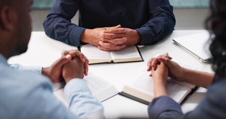 Diverse Group Praying Together, Studying Bible In Local Church