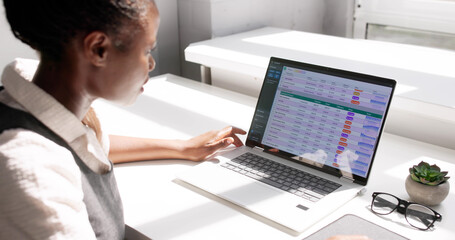 Professional African American Analyst Using Laptop