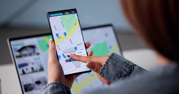 Real Estate Agent: Young Woman Checking Property Listings