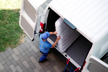 Busy Day: Mover Carrying Boxes Into New Home