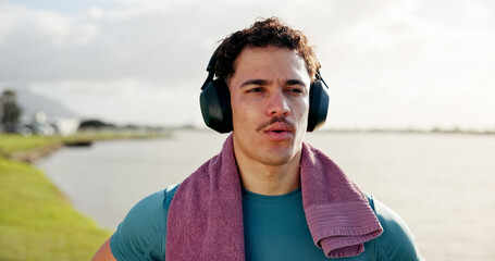 Running, thinking or man in lake with headphones for outdoor training, workout or exercise. Towel,...