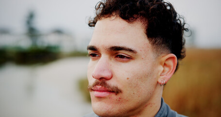 Serious, thinking and man for vacation outdoor for travel, weekend break and planning adventure. Closeup, male person and reflection for holiday ideas, tourist journey and nostalgia memory of getaway