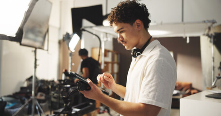 Man, director and tablet for filming backstage for editing video, review script and shooting...