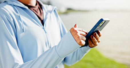 Woman, hands and fitness with phone at lake for social media, workout routine or tracking app....