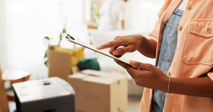 Clipboard, moving and hands of woman in new home for information on renovations or interior design. Living room, cardboard boxes and female person with checklist for planning maintenance in house.