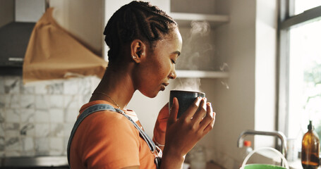 Sniffing, coffee and woman in kitchen, calm and aroma of hot tea in home, morning or peace on...