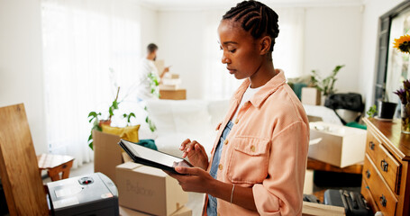 Tablet, moving and black woman in new house for research on renovations, interior design or online...