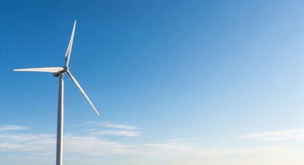 Fototapeta premium Wind Turbine Against Clear Blue Sky, Generating Clean Renewable Energy