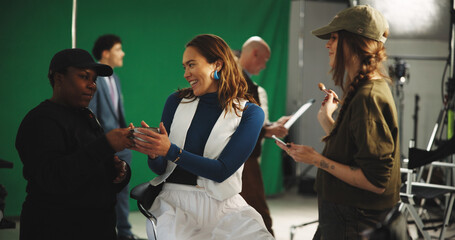 Coffee, happy and woman model with makeup artist on set for behind the scenes preparation....