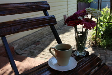 on a small table a cup of coffee in the morning in the village