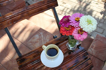 on a small table a cup of coffee in the morning in the village