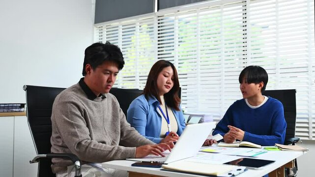 Young business creative team are brainstorming planning discussing while sitting in creative business discussing work