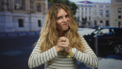 Woman fist anger urban blonde young fight street outdoor portrait capture raw emotion during tense...