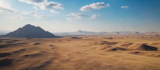 Desert landscape, mountain range, arid terrain, sunny sky, travel
