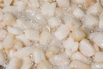 Render pork fat to extract lard and crispy pork cracklings
