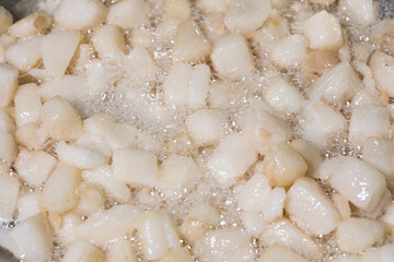 Render pork fat to extract lard and crispy pork cracklings