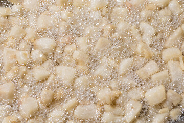 Render pork fat to extract lard and crispy pork cracklings