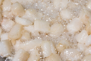 Render pork fat to extract lard and crispy pork cracklings