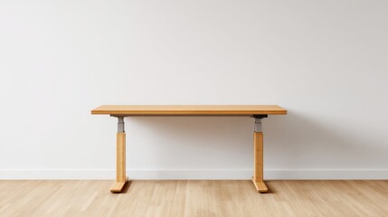 Light wooden adjustable height desk against a white wall