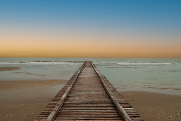 Fototapeta premium the silence of winter on the sea on a splendid day at sunset