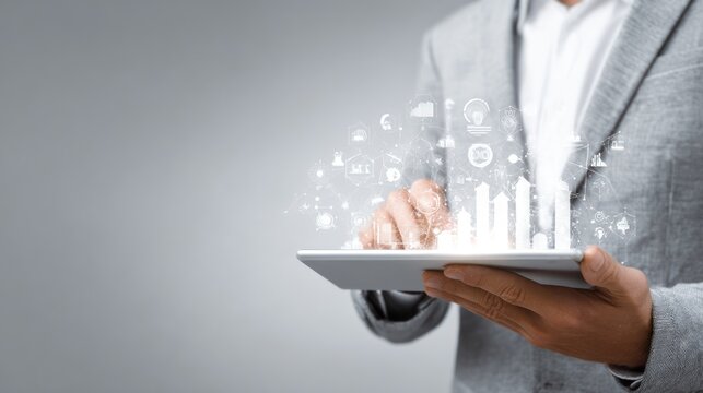 Businessman using digital tablet with holographic data visualizations