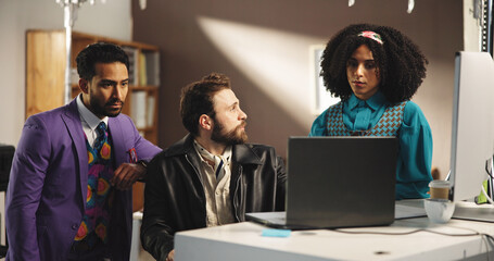 Business, fashion designer and team on laptop for planning, discussion and brainstorming retro...