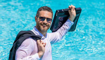 Excited businessman on summer vacation. Freelancer has remote work. Businessman in suit with...