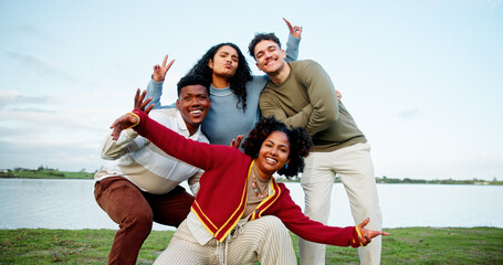 Happy, portrait of group of friends outdoor for holiday, weekend trip or getaway together. People, connection and students with smile in nature for travel, vacation or adventure by lake for bonding.